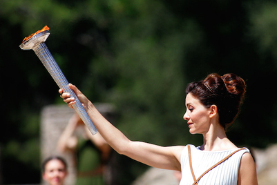 OLYMPIA, GREECE - APRIL 20: Actress Katerina Lechou acting the high pristess holds the Olympic Torch at the Ancient Stadium during the Rehearsal for the Lighting Ceremony of the Olympic Flame at Ancient Olympia on April 20, 2016 in Olympia, Greece. (Photo by Milos Bicanski/Getty Images)